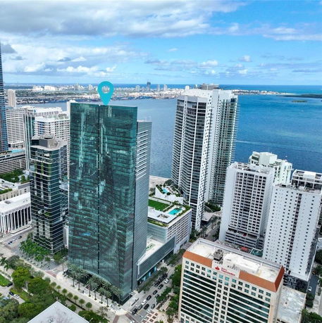 Aerial view of skyscrapers by the waterfront.