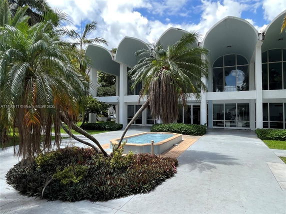 Front view of a building with arched windows and a modern design.