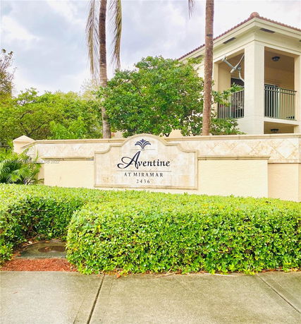 Front view of a residential building with a sign reading 'Aventine at Miramar 2436'.