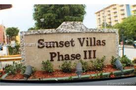 Sign for Sunset Villas Phase III in an outdoor setting.