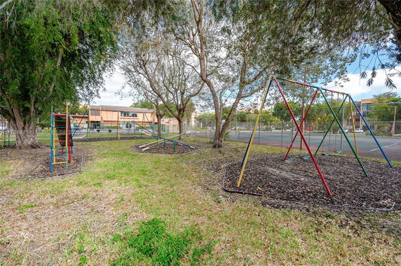Playground with swings and climbing structures.