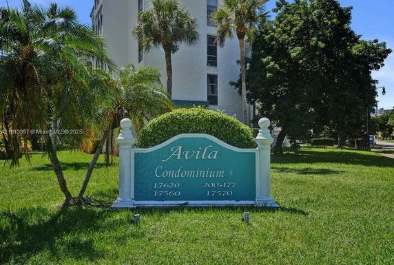 Front view of a condominium building with a sign reading 'Avila Condominium.'