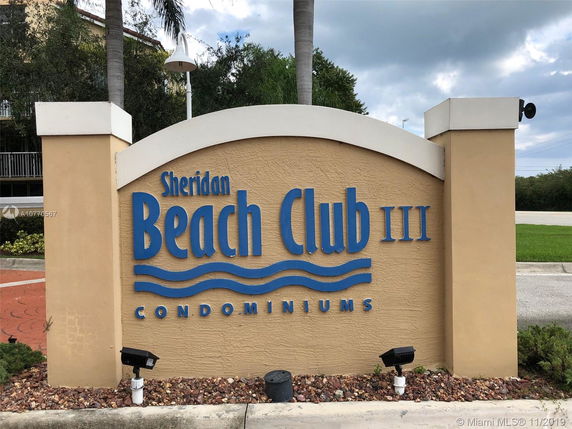 Sign for Sheridan Beach Club III Condominiums at the entrance.