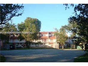 Front view of a residential building with multiple floors.