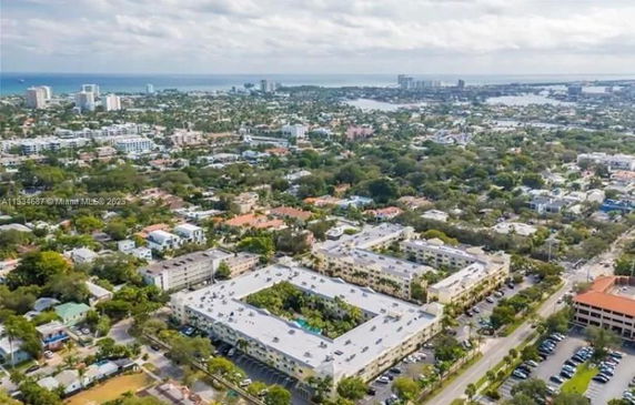 Panoramic view of a residential area with multiple buildings and greenery.