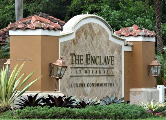 Front view of the entrance sign for a luxury condominium community.