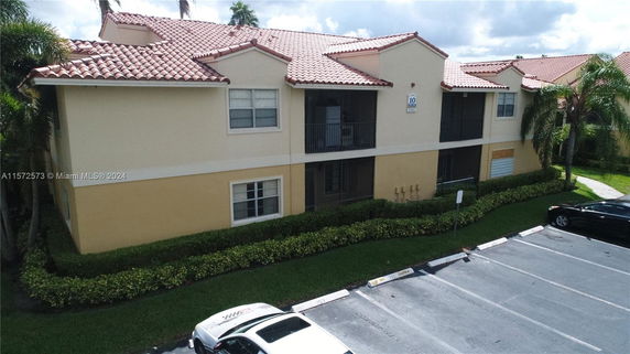 Front view of a two-story building with a red-tiled roof.