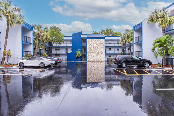 Apartment building with adjacent parking area