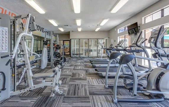 Indoor gym area with various exercise equipment.