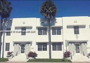 Front view of a two-story building with multiple entrances.