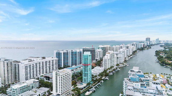 Panoramic view of coastal high-rise buildings along the ocean.