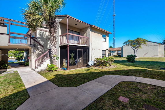 Front view of a two-story residential building with balconies.