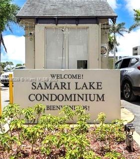 Front view of a condominium entrance with a welcome sign.