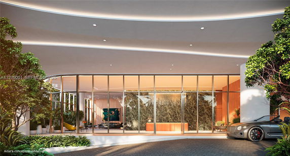 Front view of a modern building with large glass windows and a smooth curved roof.