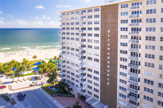 Front view of a high-rise beachfront building named 'Ocean Monarch'.