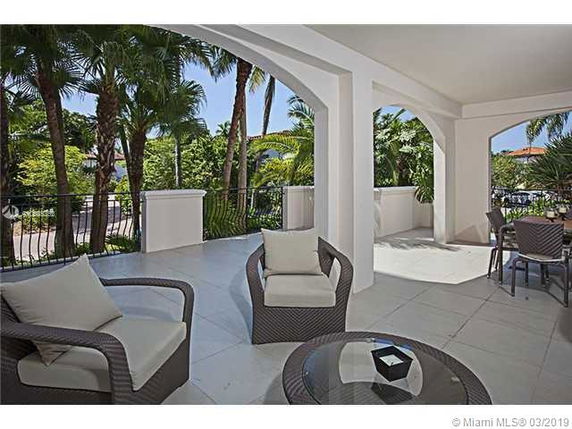 Spacious outdoor patio area with seating and garden view.