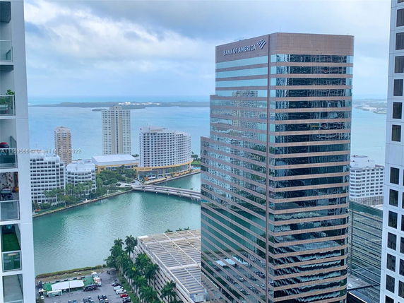 High-rise buildings with a waterfront view in an urban setting.