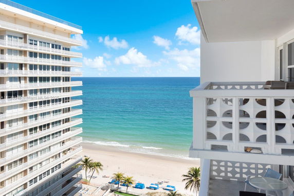 View from a building overlooking the ocean and beach.
