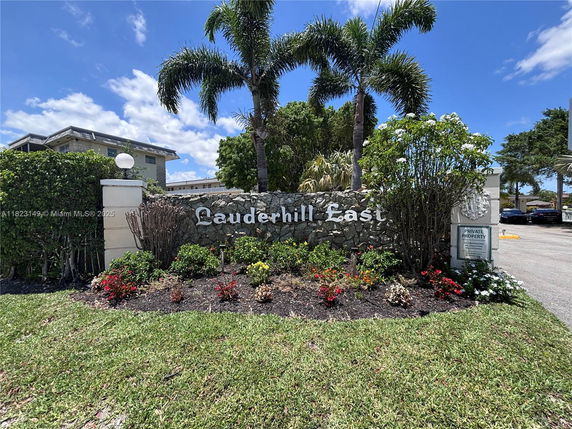 Front view of Lauderhill East building entrance with landscaping.
