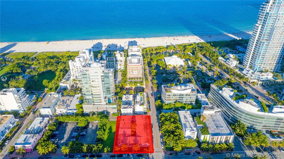 Aerial panoramic view of buildings near a beach.