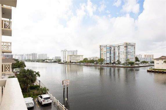 Panoramic view of a waterfront area with high-rise buildings.
