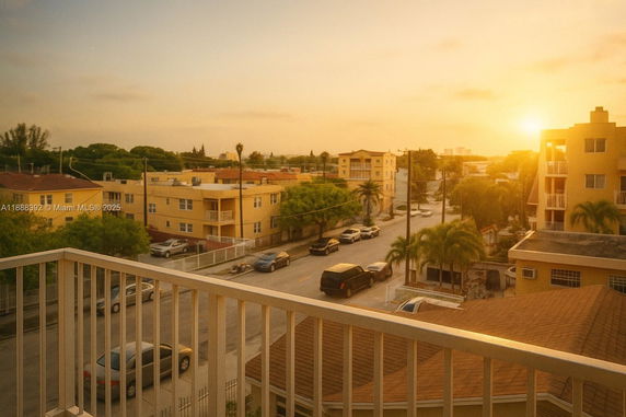 Panoramic view of residential area from a balcony at sunset.