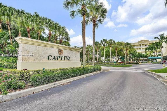 Front view of a multi-story building with Captiva sign and palm trees.