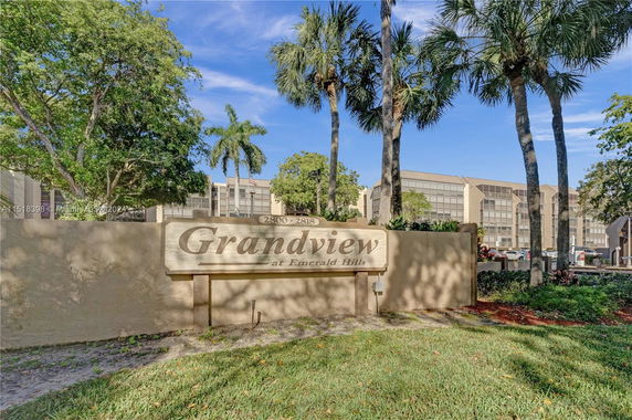 Entrance sign and view of apartment buildings at 'Grandview at Emerald Hills.'