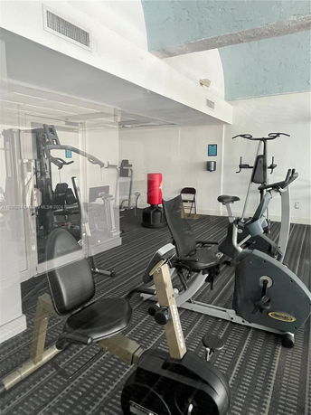 Interior view of a fitness room with exercise equipment.