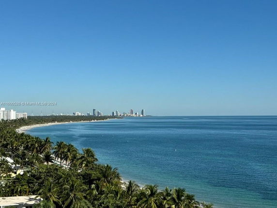 View of a coastline with buildings and the ocean.