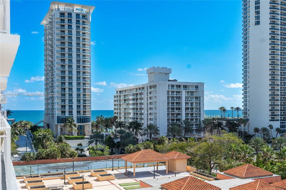 View of tall residential buildings near a coastline.