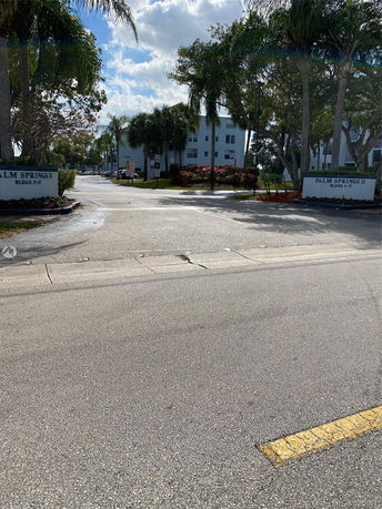 Front view of an apartment complex with multiple stories.
