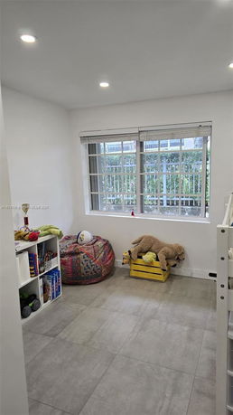 A small room with toys and seating for children.