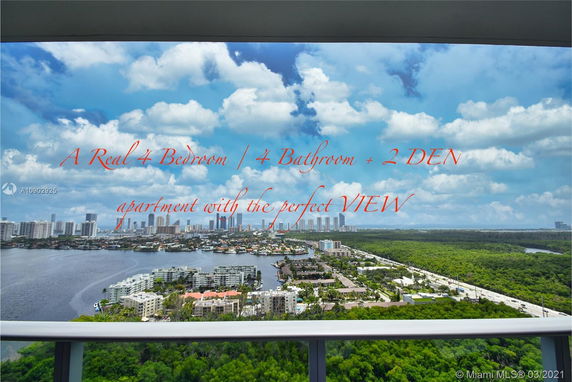Panoramic view from a high-rise apartment overlooking a cityscape and greenery.