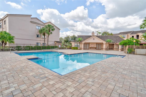Outdoor swimming pool area near residential buildings