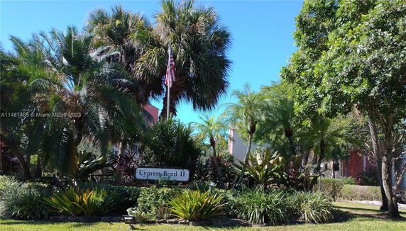 View of Cypress Bend II area with palm trees and landscaping.