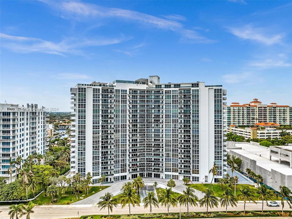 Front view of a high-rise residential building with multiple floors and a modern design.