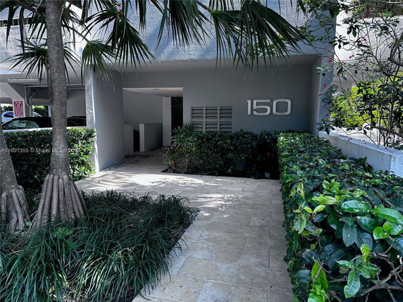 Front view of a building entrance with the number 150 displayed.
