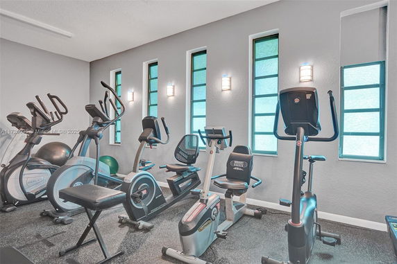 Indoor gym area with exercise bikes and fitness equipment.