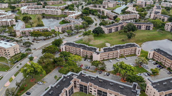 Aerial view of a residential area with multiple apartment buildings and roads.