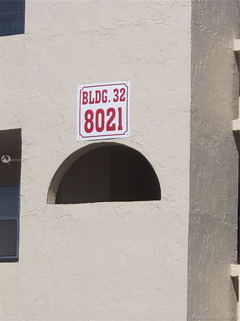 Close-up view of building exterior with a sign labeled BLDG. 32 8021.
