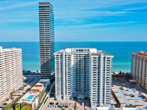High-rise buildings with ocean in the background