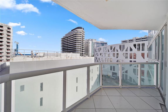 View of modern buildings from a balcony.