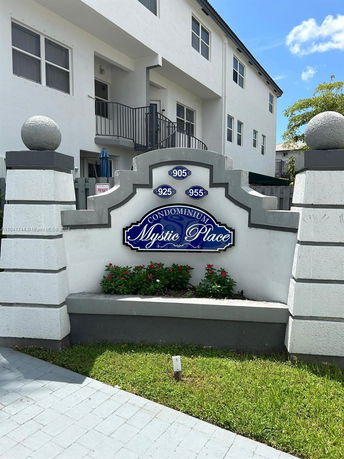Front view of a condominium complex named Mystic Place.