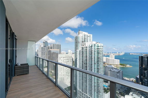 Balcony view overlooking city skyline and waterfront.