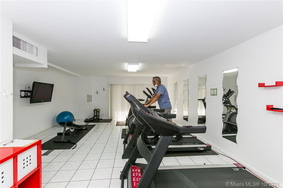 Indoor gym area with treadmills and exercise equipment.