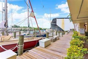 Dock area with boats and a waterway view.