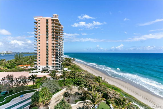 View of a beachfront high-rise building and the ocean.