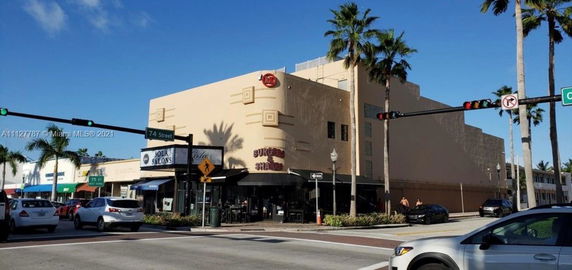 Front view of a commercial building at a street corner.