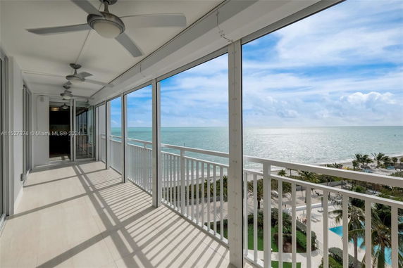 Balcony view overlooking the ocean and beach area.